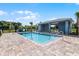 Inviting community pool featuring an open cabana and a surrounding iron fence at 552 Zinfandel Dr, Daytona Beach, FL 32117