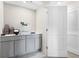 Spacious laundry room with ample storage cabinets, and countertop for folding and organizing at 552 Zinfandel Dr, Daytona Beach, FL 32117