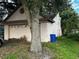 Single-story home with a two-car garage and mature trees surrounding the property at 567 Queensbridge Dr, Lake Mary, FL 32746