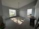 Spacious living room with plush carpet, natural light, and a serene ambiance at 567 Queensbridge Dr, Lake Mary, FL 32746