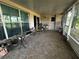 Screened patio with tile flooring, ample seating and decor, ideal for outdoor relaxation and entertaining at 567 Queensbridge Dr, Lake Mary, FL 32746