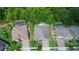 An aerial view of a well-maintained home with a pool and lush greenery at 595 American Holly Pl, Oviedo, FL 32765