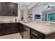 Spacious kitchen with stainless steel appliances, and granite countertops perfect for cooking and entertaining at 595 American Holly Pl, Oviedo, FL 32765