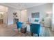 Bright living room featuring comfortable seating, a decorative rug, and stylish decor for a welcoming atmosphere at 595 American Holly Pl, Oviedo, FL 32765