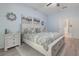 Tranquil main bedroom featuring a comfortable bed, soothing paint color, and convenient access to the en-suite bathroom at 595 American Holly Pl, Oviedo, FL 32765