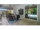 Back patio with outdoor dining set and seating area, great for entertaining guests at 595 American Holly Pl, Oviedo, FL 32765