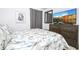 Tranquil bedroom with patterned bedding, modern decor, and soft light provides a peaceful retreat at 6543 Orange Cream Aly, Winter Garden, FL 34787