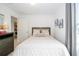 Cozy bedroom with neutral tones, comfortable bed, and easy access to the laundry is perfect for relaxation at 6543 Orange Cream Aly, Winter Garden, FL 34787