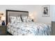 Comfortable bedroom features two bedside lamps and a decorative framed art picture at 6543 Orange Cream Aly, Winter Garden, FL 34787