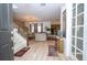 Welcoming entryway with wood-look flooring, staircase, and a seamless transition to the living areas at 6543 Orange Cream Aly, Winter Garden, FL 34787