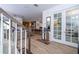 Inviting entryway with wood-look flooring, staircase, and a view of the living spaces at 6543 Orange Cream Aly, Winter Garden, FL 34787