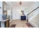Bright entryway featuring wood-look floors, a staircase, and decorative accents at 6543 Orange Cream Aly, Winter Garden, FL 34787