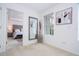 Bright hallway leads to a bedroom, offering a glimpse of the serene decor and natural light at 6543 Orange Cream Aly, Winter Garden, FL 34787