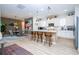 Bright kitchen with a large island, pendant lighting, and adjacent dining area at 6543 Orange Cream Aly, Winter Garden, FL 34787