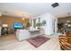 Bright and airy living room with light wood floors, a comfortable sofa, and neutral decor at 6543 Orange Cream Aly, Winter Garden, FL 34787