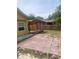 Paver patio in a backyard featuring a modern pergola perfect for outdoor entertaining at 701 Twin Lake Ave, Deltona, FL 32738