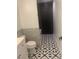 Bathroom featuring modern floor tile and subway tile border at 701 Twin Lake Ave, Deltona, FL 32738