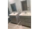 Bright bathroom featuring dual sink vanities, mirrors and drawers offering ample storage at 701 Twin Lake Ave, Deltona, FL 32738