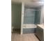 Relaxing bathroom featuring a soaking tub, a tiled shower, and a vanity with modern finishes at 701 Twin Lake Ave, Deltona, FL 32738