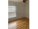 Bedroom with laminate flooring, ceiling fan, and window at 701 Twin Lake Ave, Deltona, FL 32738