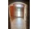 Welcoming foyer with decorative door, tiled floor, and barn door detail offering a bright entryway at 701 Twin Lake Ave, Deltona, FL 32738