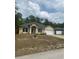 Charming home with a well-manicured front yard and a two-car garage, great curb appeal at 701 Twin Lake Ave, Deltona, FL 32738