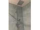 Shower featuring a modern showerhead and blue subway tile surround at 701 Twin Lake Ave, Deltona, FL 32738