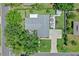 Aerial view of the property showcasing the house, backyard, driveway, and surrounding landscaping at 711 Valencia Ct, Winter Garden, FL 34787
