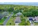 Aerial view of the property showcasing its proximity to the lake, and the overall lot and layout at 711 Valencia Ct, Winter Garden, FL 34787