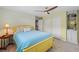 Bedroom with light wood floors, a bright yellow bed frame, a ceiling fan, and a built in book shelf at 711 Valencia Ct, Winter Garden, FL 34787