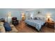 Bedroom with wood floors, a ceiling fan, a couch, and a leather recliner at 711 Valencia Ct, Winter Garden, FL 34787