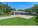 Well-maintained property featuring a two-car garage, private fencing, and ample parking space at 711 Valencia Ct, Winter Garden, FL 34787