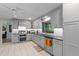 Beautiful kitchen with updated appliances, gray cabinets, stainless steel dishwasher, and subway tile backsplash at 711 Valencia Ct, Winter Garden, FL 34787