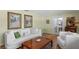 Cozy living room featuring a plush sofa, tile floors, and warm natural light at 711 Valencia Ct, Winter Garden, FL 34787