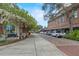 Picturesque street scene with charming buildings, parked cars, and lush landscaping, showcasing the vibrant area at 711 Valencia Ct, Winter Garden, FL 34787