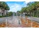 Beautiful water fountain in a picturesque park setting, perfect for relaxation and enjoying the outdoors at 711 Valencia Ct, Winter Garden, FL 34787