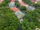 Aerial view of a residential home nestled among lush greenery and neighboring houses at 7698 Mount Carmel Dr, Orlando, FL 32835