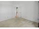 Neutral bedroom with carpet, white walls and an open doorway at 7698 Mount Carmel Dr, Orlando, FL 32835
