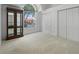 Bright bedroom with large window, display cabinet and double door closet at 7698 Mount Carmel Dr, Orlando, FL 32835