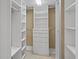 Walk-in closet with custom shelving and drawers for optimal storage at 7698 Mount Carmel Dr, Orlando, FL 32835