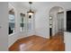 Charming dining room with hardwood floors and natural light, adjacent to kitchen area at 7698 Mount Carmel Dr, Orlando, FL 32835