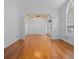 Spacious dining room with hardwood floors, crown molding, and ample natural light from the large windows at 7698 Mount Carmel Dr, Orlando, FL 32835