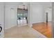 Inviting foyer featuring tile and wood flooring, arched doorways, and views of the living room and pool area at 7698 Mount Carmel Dr, Orlando, FL 32835
