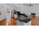 Stylish kitchen with granite countertops, stainless steel appliances, and open layout at 7698 Mount Carmel Dr, Orlando, FL 32835
