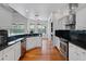 Well-equipped kitchen with stainless steel appliances and granite countertops with pool views at 7698 Mount Carmel Dr, Orlando, FL 32835
