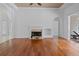 Spacious living room with hardwood floors, fireplace, and access to outdoor area at 7698 Mount Carmel Dr, Orlando, FL 32835
