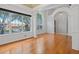 Spacious and bright living area featuring hardwood floors, large windows, and elegant architectural detailing at 7698 Mount Carmel Dr, Orlando, FL 32835