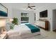 Bedroom with pool view and modern décor, ceiling fan, and ensuite bath at 7698 Mount Carmel Dr, Orlando, FL 32835