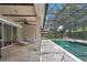 Enjoy the backyard covered pool with a brick lanai and a ceiling fan for hot days at 7698 Mount Carmel Dr, Orlando, FL 32835
