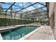 Enjoy this in ground pool with screen enclosure, a perfect spot for summer fun at 7698 Mount Carmel Dr, Orlando, FL 32835